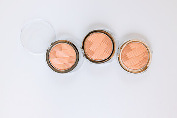 Palette of multicolor cosmetic makeup with a eyeshadow palette, colorful shadows minimalism on isolated white background