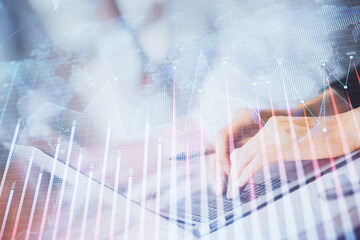 Double exposure of woman hands typing on computer and forex chart hologram drawing. Stock market invest concept.