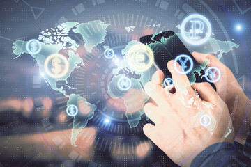 Double exposure of man's hands holding and using a digital device and forex graph drawing. Financial market concept.