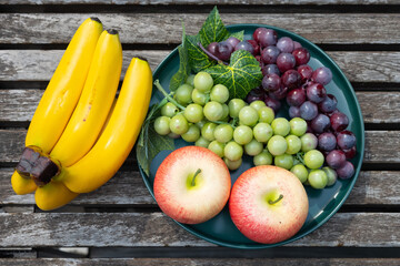 top view artificial fruits on a wood table horizontal composition