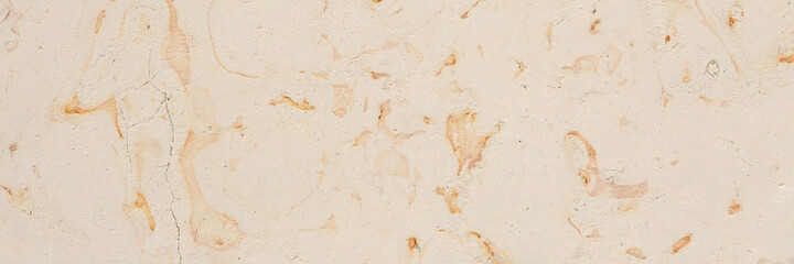 Dolomite texture. Natural rock with beautiful beige patterns on the surface. Polished flat stone. Classic luxury decoration building material. Wide panoramic texture for background and design.