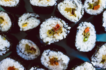 plant-based food, homemade vegan sushi with stir fried vegetable filling