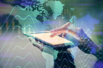 Obraz premium Double exposure of forex chart sketch hologram and woman holding and using a mobile device. Financial market concept.