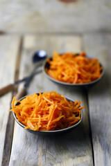 Korean carrot salad in bowls.