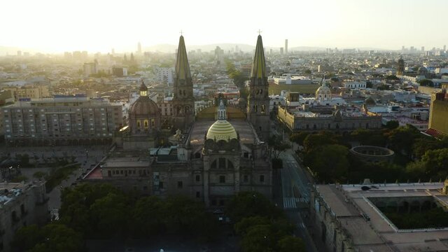 Drone Flies Between Spires of Guadalajara Cathedral in Mexico. Liberation Square
