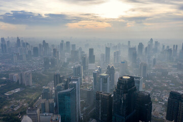 Fototapeta na wymiar Beautiful foggy Jakarta cityscape at morning