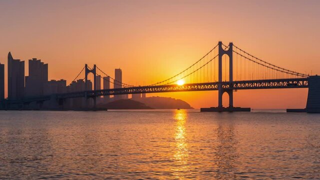 Sunrise of Gwangan Bridge and Haeundae at Busan City, South Korea.Zoom out
