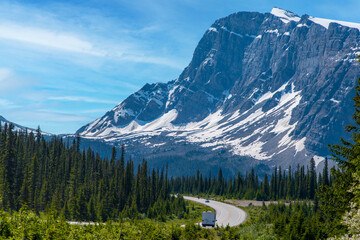 Road trip with a great view of big mountain and blue sky in Alberta, Canada