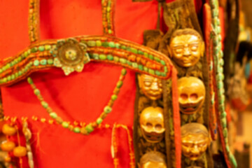 Obraz premium Blurred image of Tibetan ornaments on display at local market , Leh, Ladakh, India. These ornaments are traditional festive dresses for Ladakhi people.