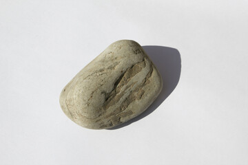 Naklejka premium Natural pebbles on white background