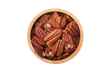 Pecan nuts in wooden bowl isolated on white