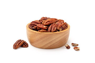 Pecans in wood bowl isolated on white