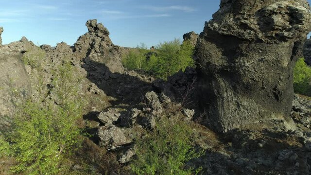 Flying through lava rock formations and trees Dimmu Borgir Iceland aerial