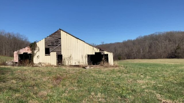 Old Abandoned Barn in the Middle of a Field