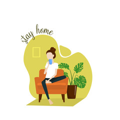 The girl sits at home in an armchair, drinks tea and relaxes. Quarantine, stay at home painting. COVID-19