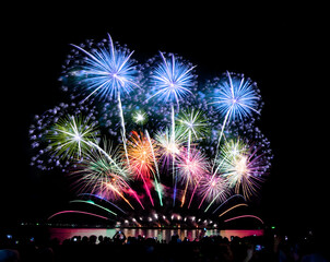 Fireworks light up the sky,Crowd watching fireworks and celebrating for Christmas and New Year design
