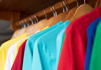 Obraz premium Colorful of T Shirts are hanging on the clothes hanger