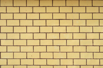 Obraz premium old yellow brick wall texture background