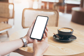 cell phone blank white screen mockup.woman hand holding texting using mobile on desk at office.background empty space for advertise.work people contact marketing business,technology