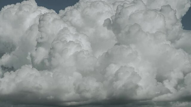 Time lapse footage of summer clouds growing and changing