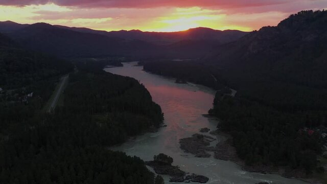 The mountain river view from high. Mountain landscapes. Pink sunset