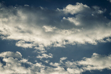 Fototapeta na wymiar Clear blue sky and white clouds. Dramatic light