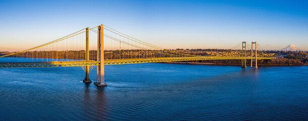 Tacoma Narrows Bridge in Washington State taken from the Gig Harbor side with Mt Rainier in the...