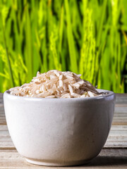 integral rice on glass bowl isolated on wooden table integral rice on glass bowl isolated on wooden table in Brazil