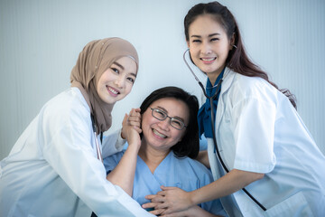 Fototapeta premium senior woman patient and young woman doctor, friendly doctor encouragement, empathy and support following a medical examination. Trust and medical ethics concept