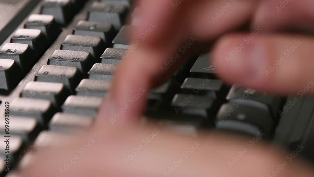 Aufkleber typing on the pc keyboard, close-up shot.working from home on the desktop computer.