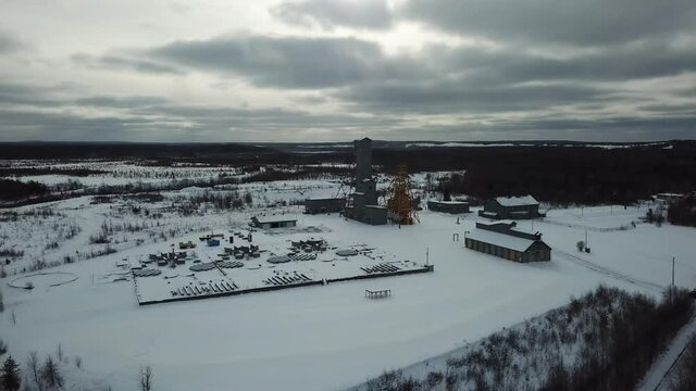 Oil And Gold Mine In Wintery Canada In The Middle Of The Forest  - Drone 4k Aerial