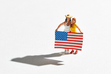Two women with American flag miniature