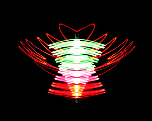Fototapeta na wymiar Colorful Neon light painting effect. Abstract luminous swirl tail Lights shape at motion on isolated with black background.