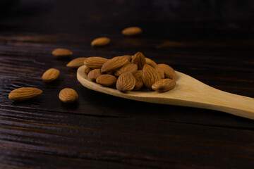 Almonds in a wooden spoon