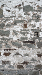 An old wall made of natural stone. Grunge background texture for design.