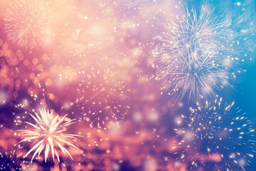 Abstract holiday background of magic fireworks of New Year.