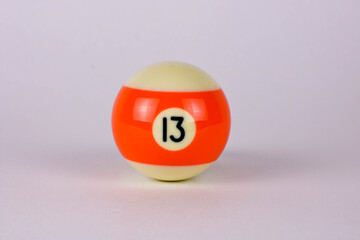 Shiny orange white ball number 13 for billiard isolated on white background