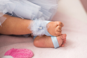 little baby's feet with special shoes
