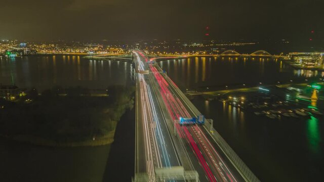 Aerial hyperlapse of a highway in the Netherlands road traffic passing timelapse commuting everning night dark top down fly over