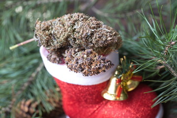big cannabis cone christmas decoration. marijuana close up. hemp buds.
