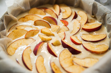 sliced apples in a batter before the baking