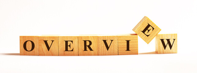 On a light background, wooden cubes with the text OVERVIEW