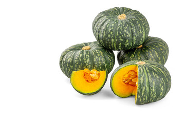 A pile of Japanese pumpkins isolated on a white background, both in ball and cut, showing yellow flesh, With clipping path