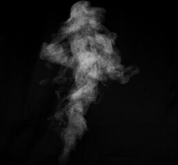 White smoke on black background. Figured smoke on a dark background. Abstract background, design element