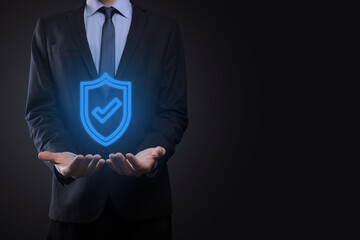 Protection network security computer in the hands of a businessman. business, technology, cyber security and internet concept - businessman pressing shield button on virtual screens Data protection