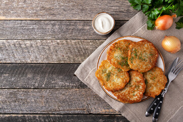 Potato pancakes with sour cream. Top view, text space