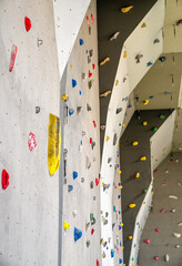 Grey climbing wall with holds