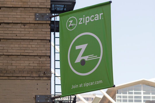 San Francisco, CA, USA - Feb 8, 2020: The Zipcar banner is seen outside one of its service centers in San Francisco. Zipcar is an American car-sharing company and a subsidiary of Avis Budget Group.