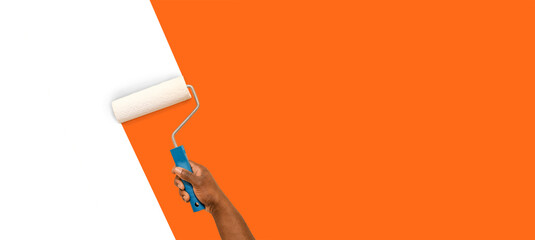 Hand of African-American worker painting wall