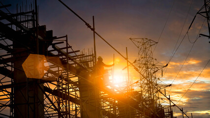 Silhouette Engineer and construction team working at site over blurred  industry background with...